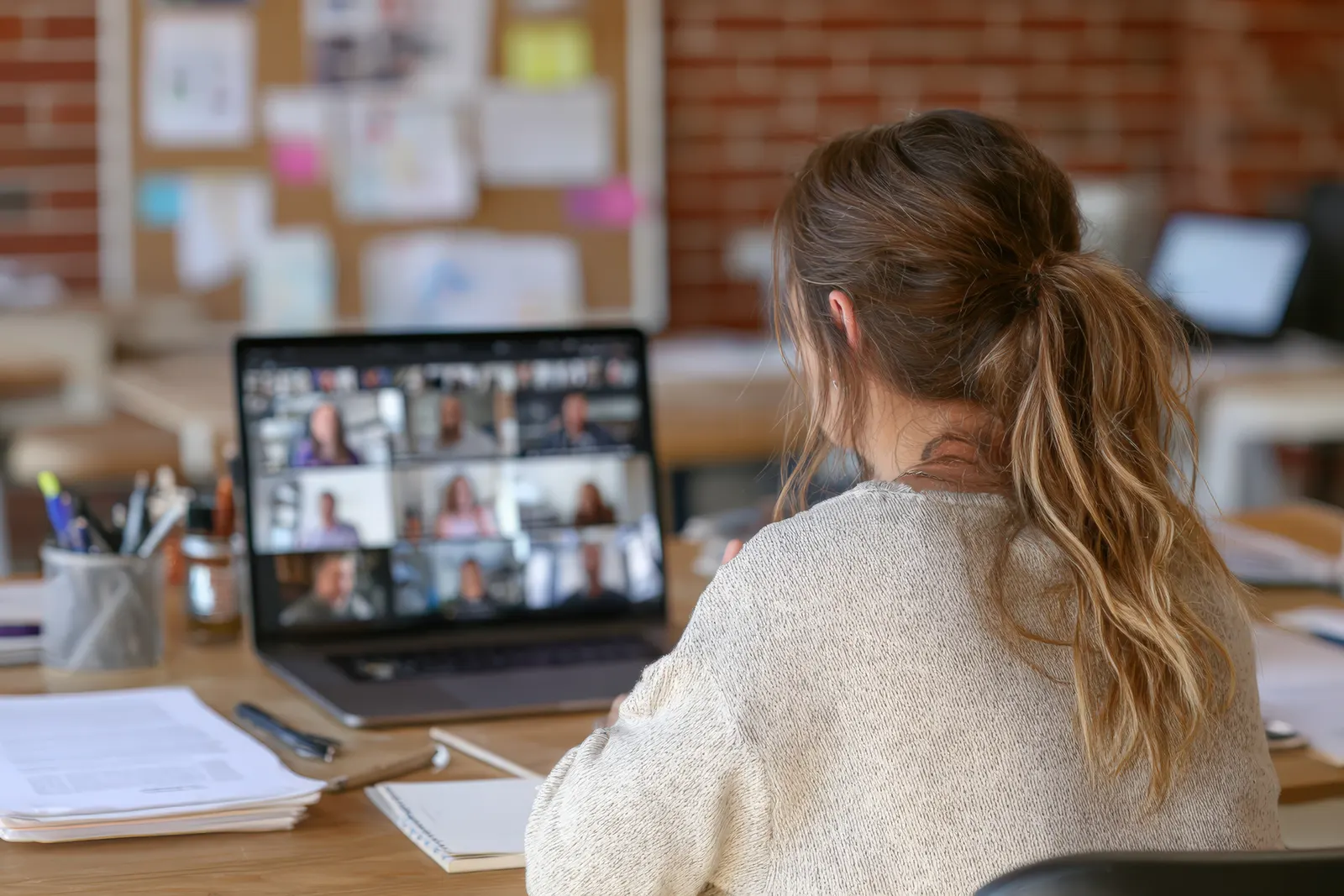 A user joining a video call on a laptop